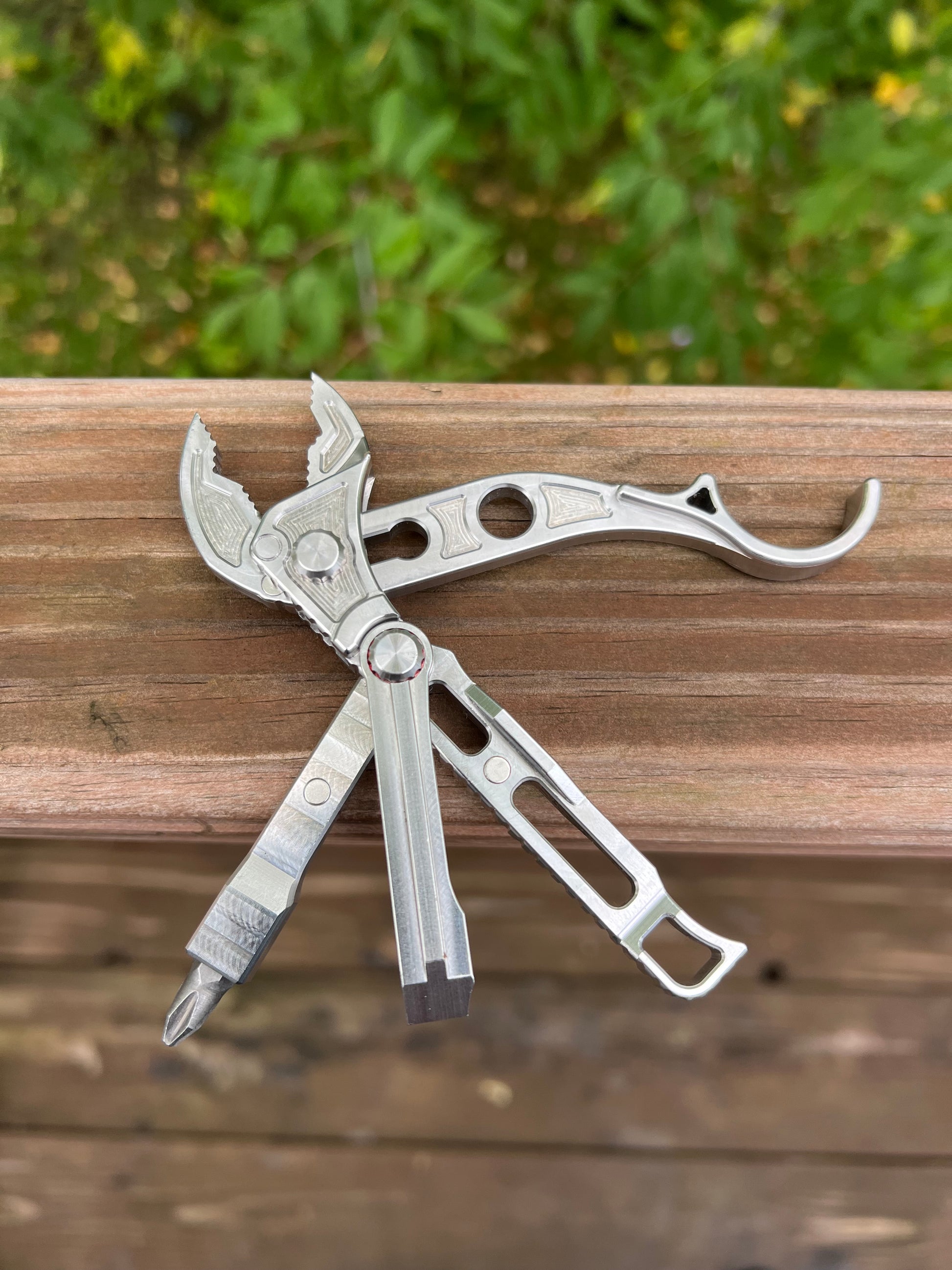 Compact billet multi-tool with pry bar and bit holder