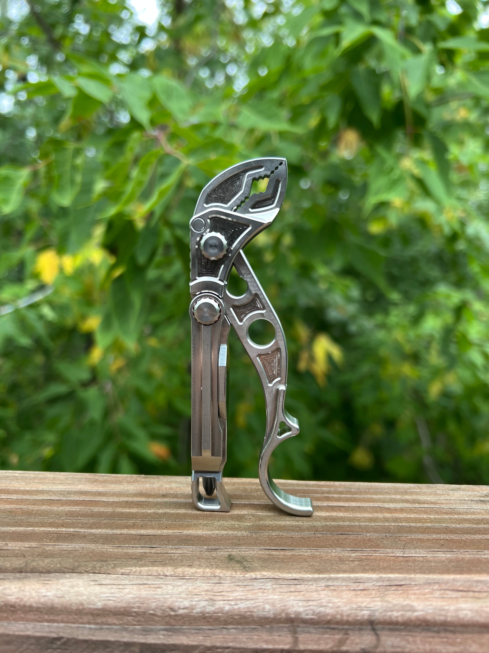 American-made M1 pocket multi-tool on wood background
